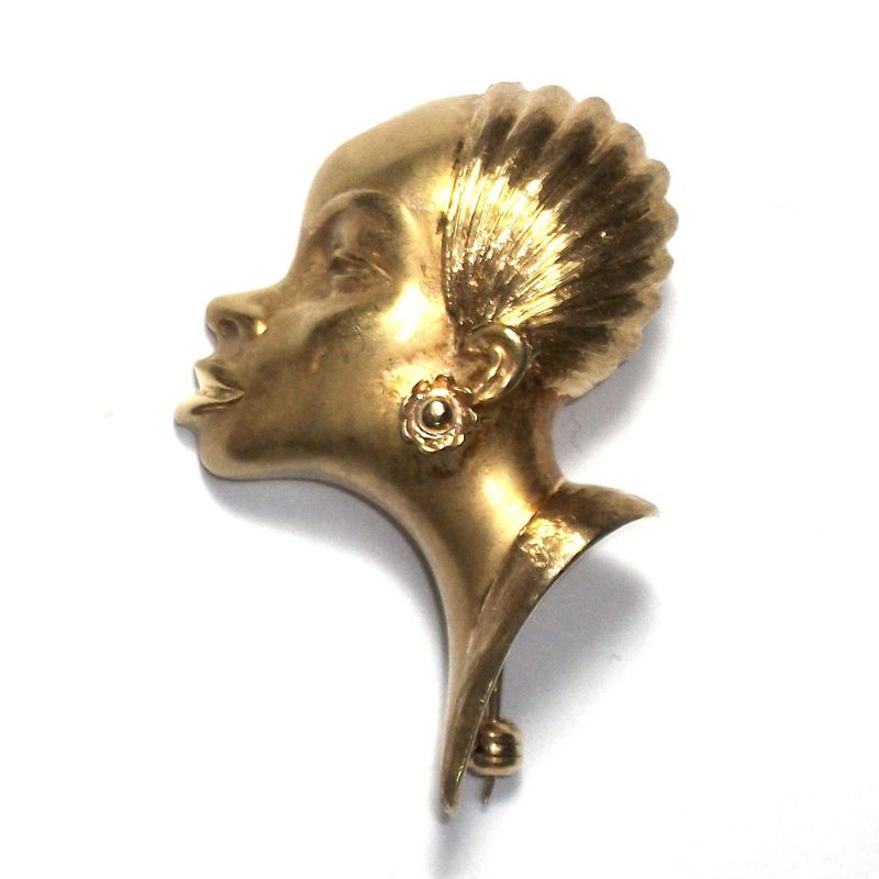 Broche con rostro femenino en oro de 18k. S. XX.: Catálogo de Antigua Joyeros