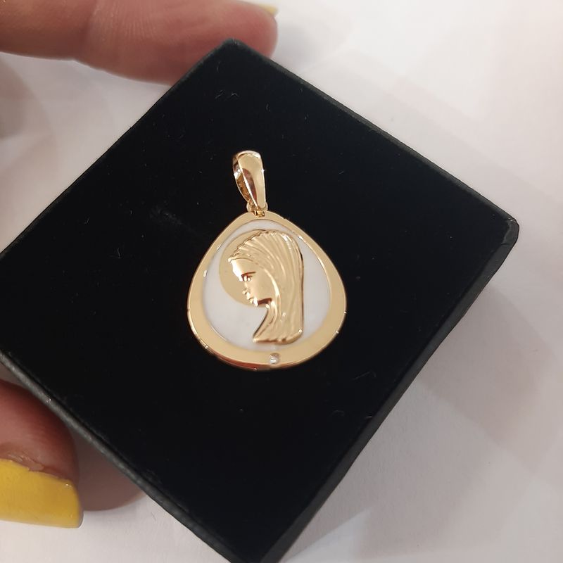 Medalla oro Virgen niña: Catálogo de Joyería Izquierdo